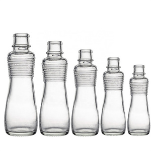 Berlin Packaging Transparent Round Sesame Seed Oil Bottle Different Sizes Unique Glass Hot Sauce Cooking Olive Oil Bottle