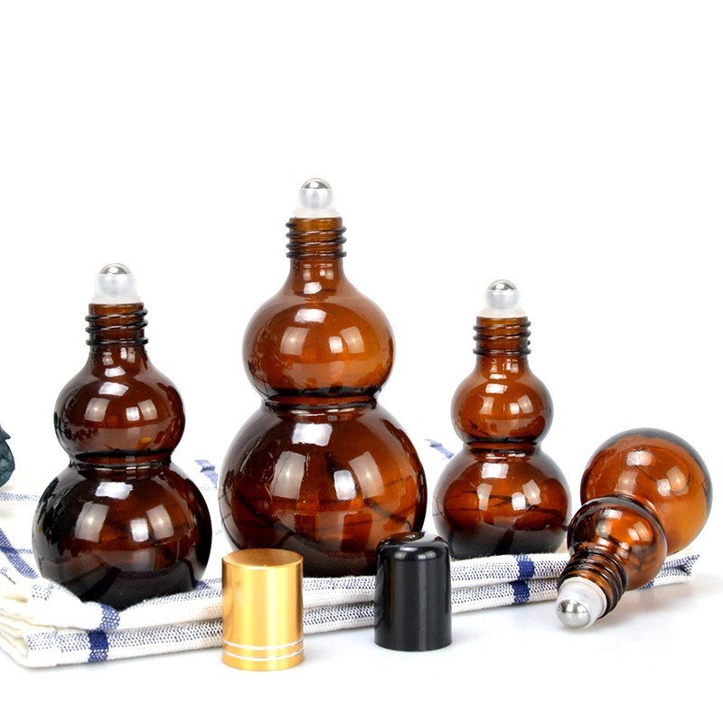 Fashion 30ml 50ml 80ml 100ml Amber Gourd Shape Essential Oil Body Perfume Glass Bottle with Roller Ball and Metal Lid