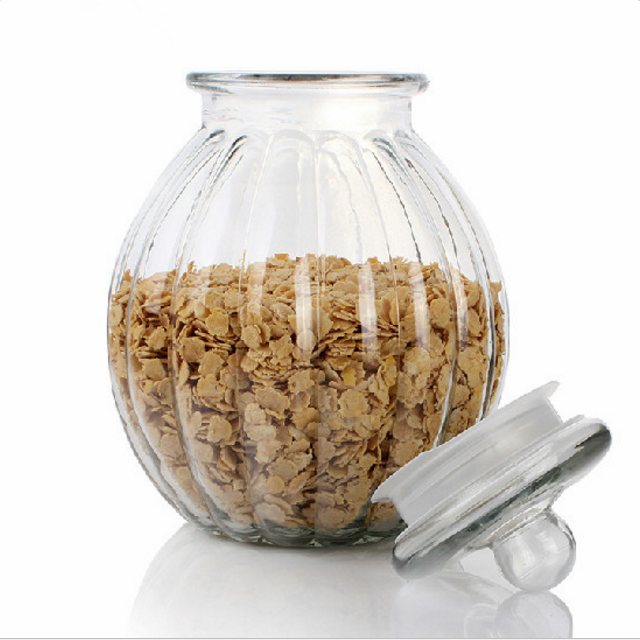 Factory price kitchen storage clear pumpkin shaped glass jars with sealed glass lids wholesale