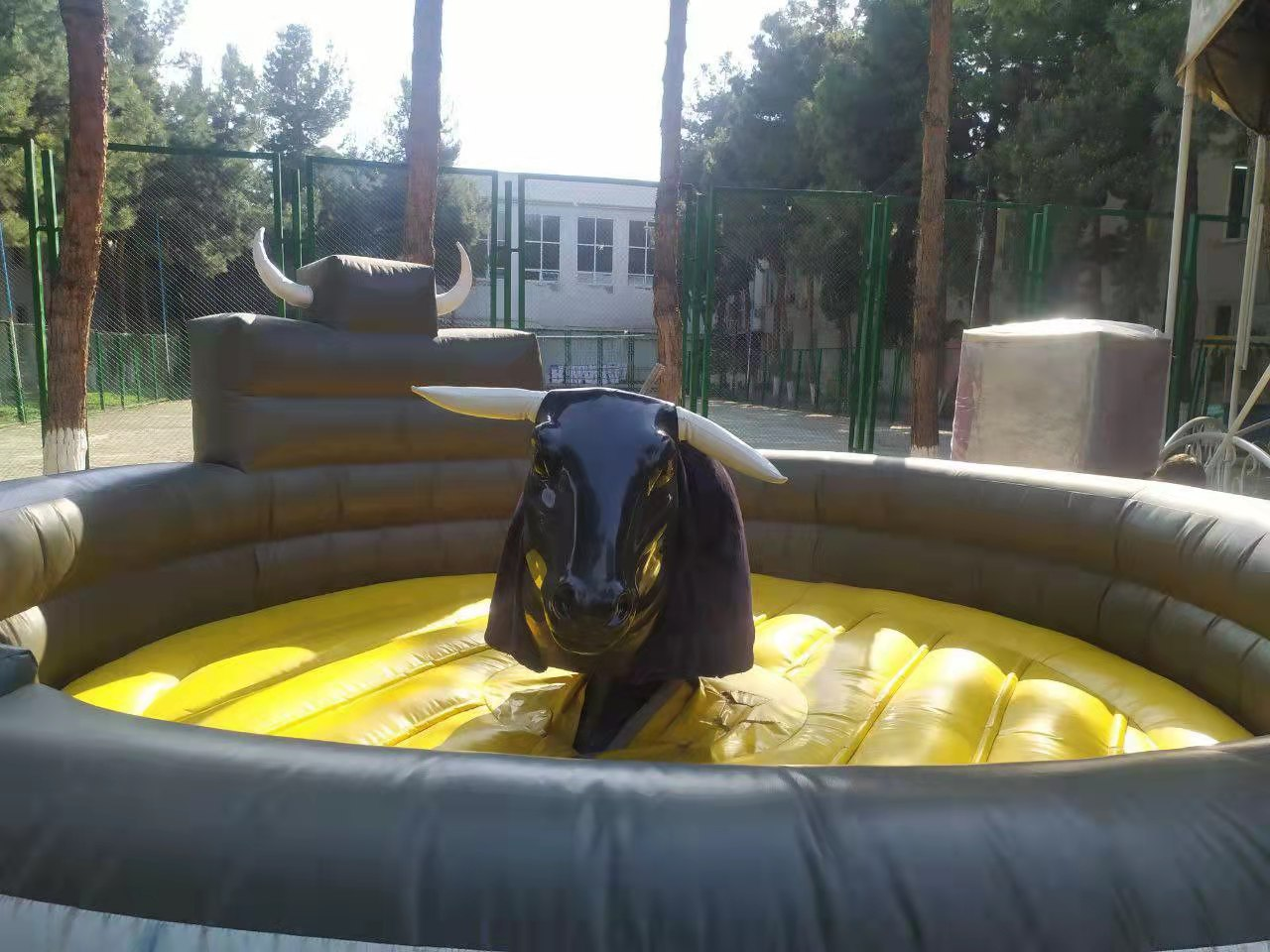 Factory price custom cheap bull games inflatable rodeo mechanical bull riding games for children and adults