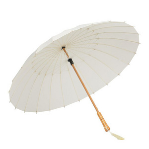 Windproof hight quality solid color 2021 new 24 ribs long umbrella white wooden handle with tassel