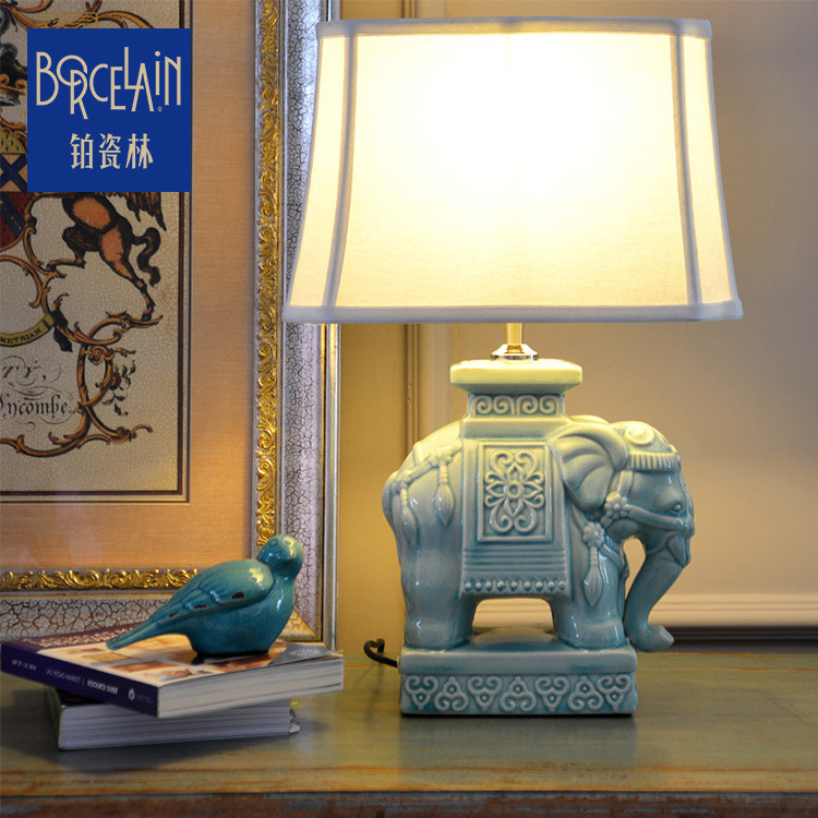 Creative fashion dynamic loaded ceramic porcelain table antique elephant lamp