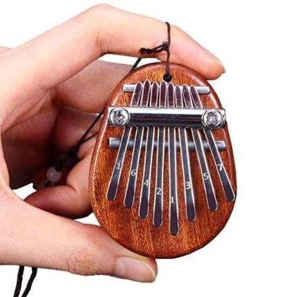 Hot Sale Mini Thumb Piano 8 Keys Portable Wooden Finger Piano Special Gifts For Kids And Adults Beginner