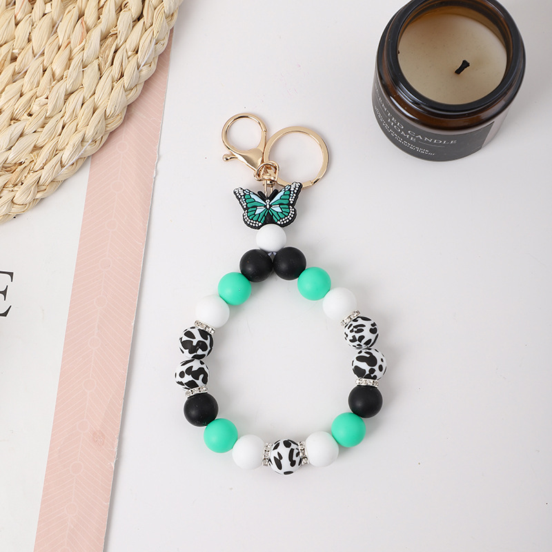 2023 New Creative Butterfly Shape Cow Silicone Beads Keychain Pendant Bracelet with Gold Buckle Rhinestone Wristlet Keychain