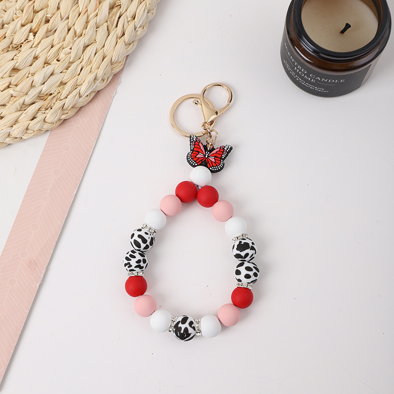 2023 New Creative Butterfly Shape Cow Silicone Beads Keychain Pendant Bracelet with Gold Buckle Rhinestone Wristlet Keychain