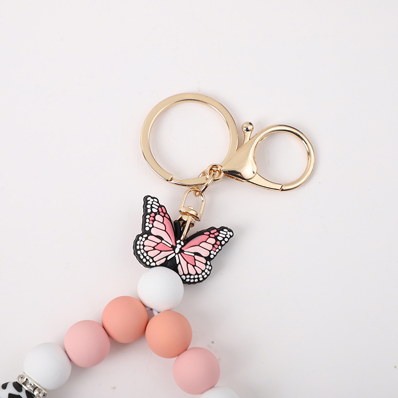 2023 New Creative Butterfly Shape Cow Silicone Beads Keychain Pendant Bracelet with Gold Buckle Rhinestone Wristlet Keychain