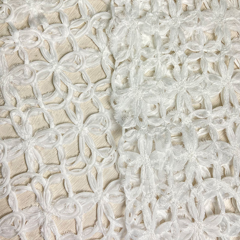 New arrival 100% polyester 180gsm comfortable hollow out pure white floral pattern sequins embroidery fabric for wedding dress