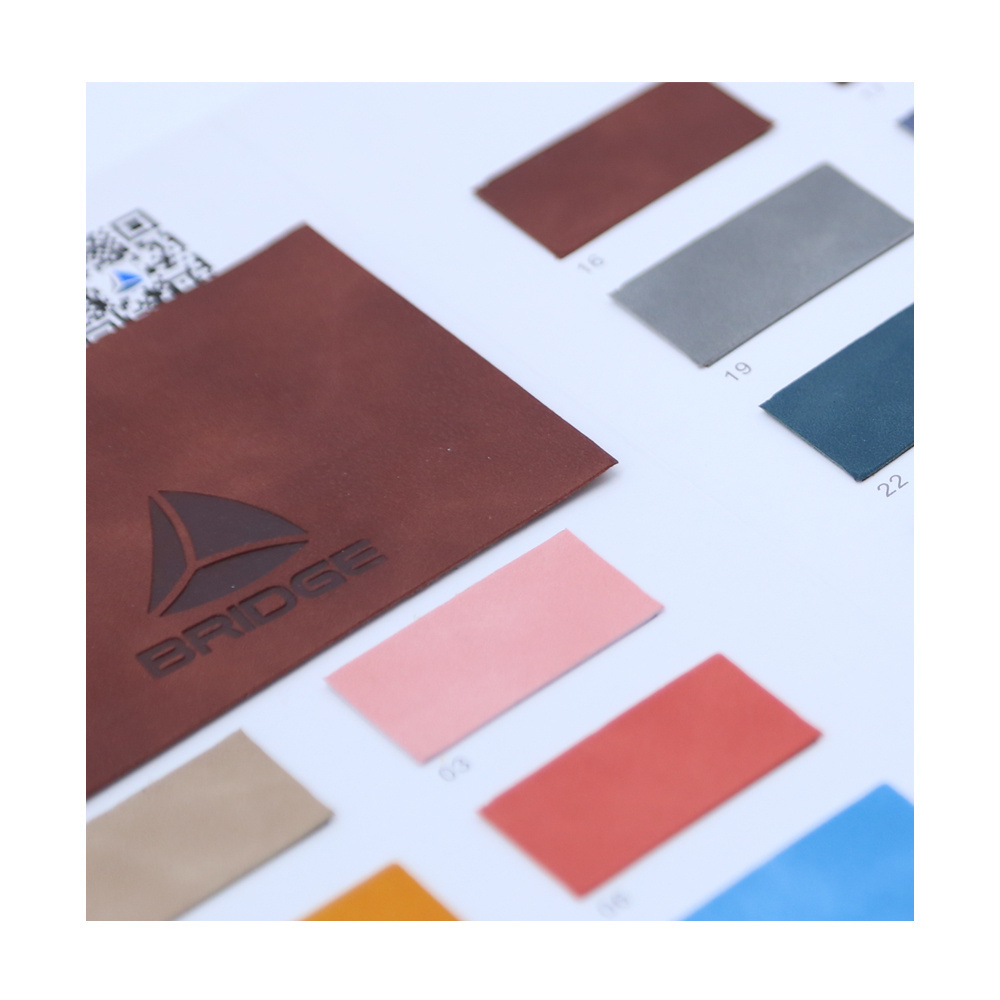 wholesale factory pressure change Color high quality Artificial Pu faux Leather fabric for Notebook and Jeans Label