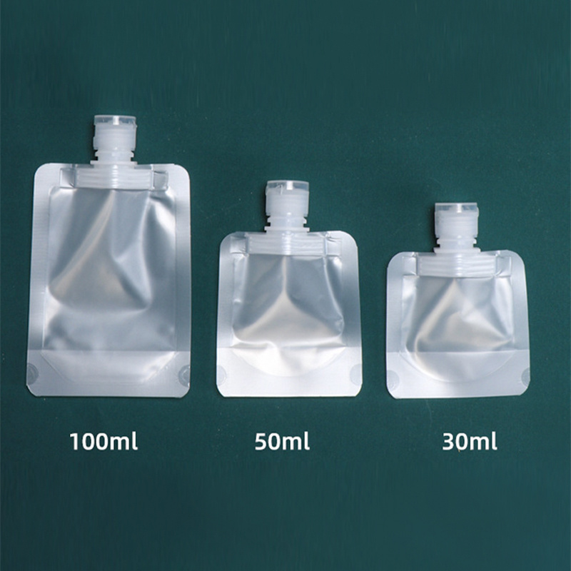 Hot sale spot liquid  30ml 50mll 100ml Transparent plastic spout bag for packing body wash shampoo Clear Dispenser Spout Pouch