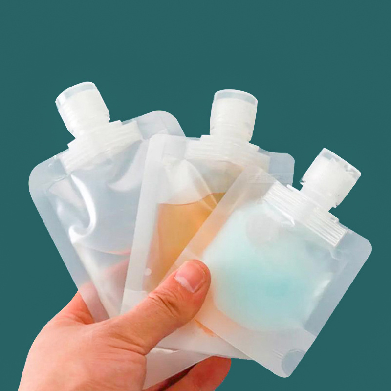 Hot sale spot liquid  30ml 50mll 100ml Transparent plastic spout bag for packing body wash shampoo Clear Dispenser Spout Pouch