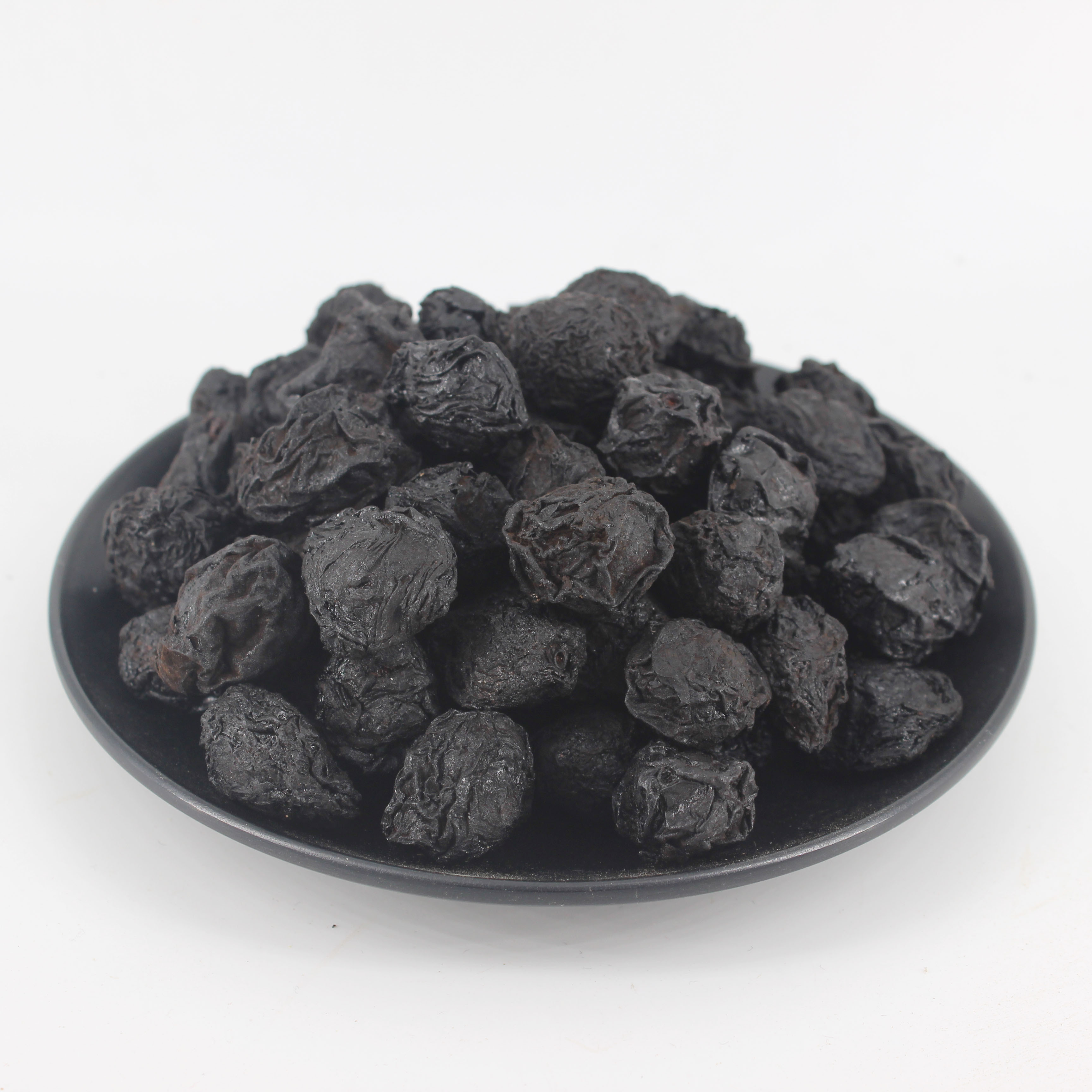 Make a sour plum drink Chinese Wu mei dried fruit prunes dark plum smoked plums