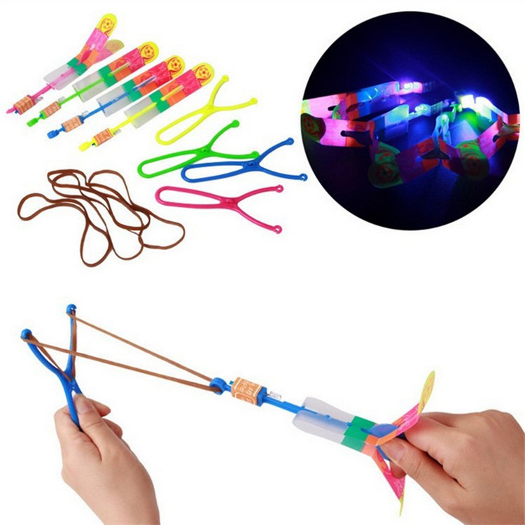 Wholesale of luminescent slingshots flying arrows blue lights double flashing children's gifts night market floor stalls toys