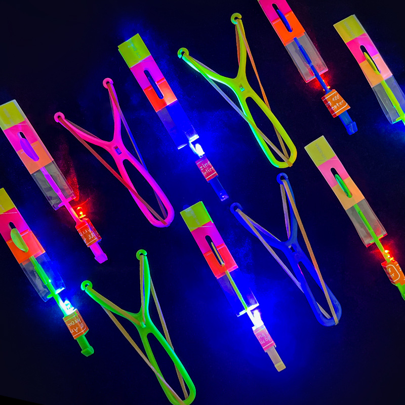 Wholesale of luminescent slingshots flying arrows blue lights double flashing children's gifts night market floor stalls toys