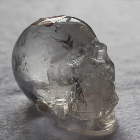 High Quality Beautiful Hand Carved Polished Clear Quartz Crystal Skull with Rainbow Crackle for Decoration