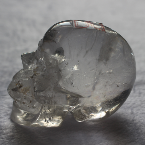 High Quality Beautiful Hand Carved Polished Clear Quartz Crystal Skull with Rainbow Crackle for Decoration