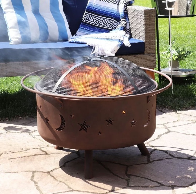 Outdoor Camping or Backyard Round Cosmic Stars and Moons Fire Pit with Cooking Grill Grate Spark Screen and Log Poker