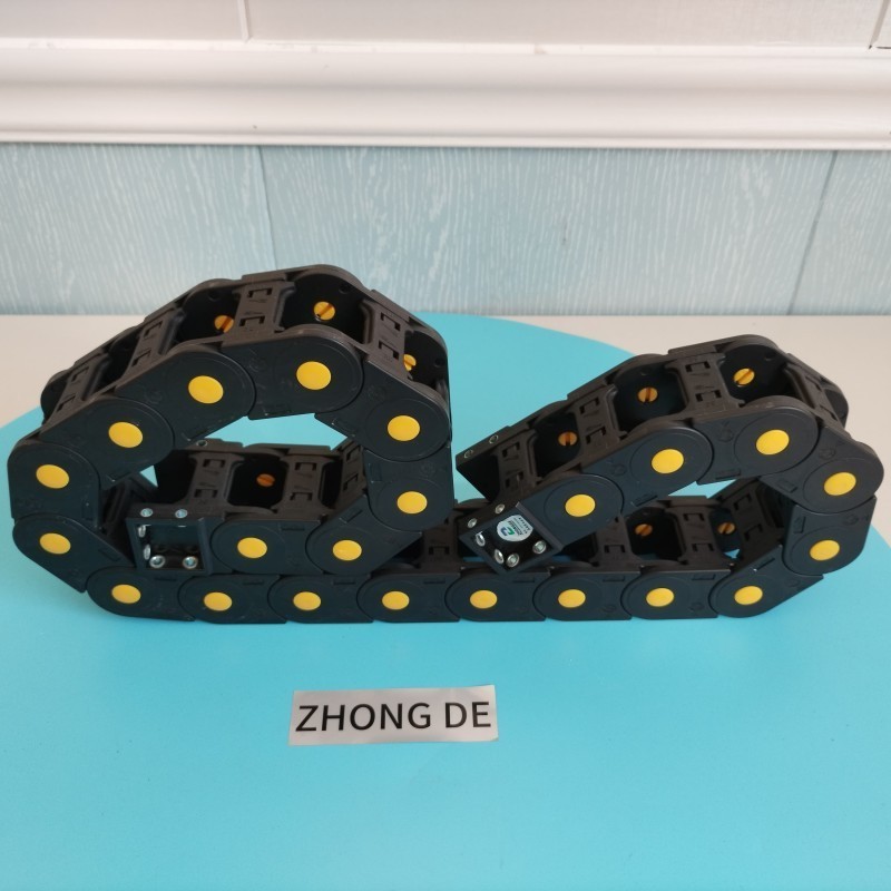 Manufacturers produce plastic cable chains, plastic nylon cable brackets, cable trays and flexible cable traction chains.