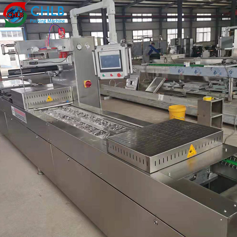 Automatic Meat Frozen Food Vacuum Packaging Machine continuous stretch film thermoforming vacuum packaging machine