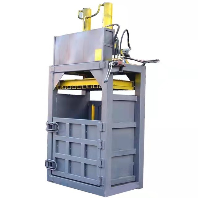 Hydraulic vertical waste paper baler pressing and strapping machine