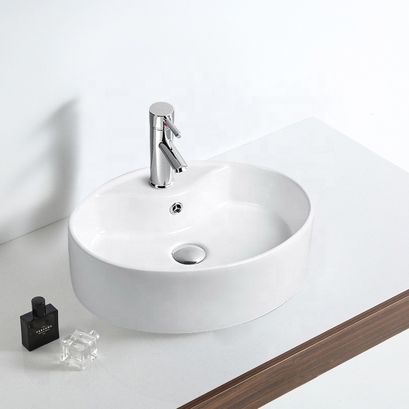 FANNISI Single faucet hold fancy table mounted round ceramic wash basin price