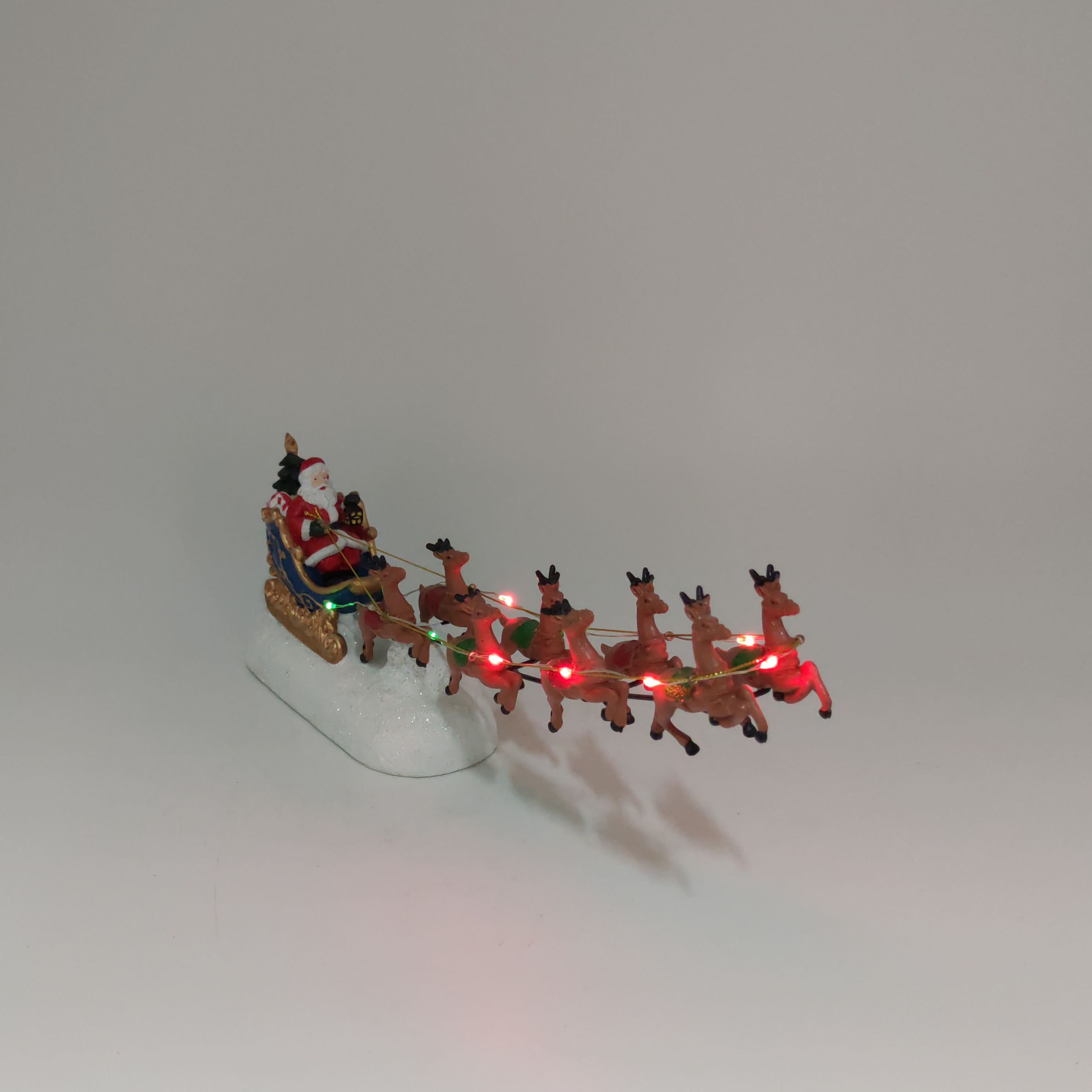 Wholesale resin christmas decoration deer pulling cart led lights electric moving music santa claus in sleigh with reindeer