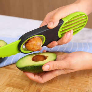 Hot cheap food grade kitchen gadget green color 3 in 1 tool fruit core remover avocado knife slicer cutter