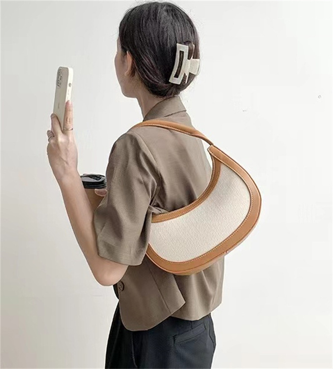 Guangzhou Factory 2023 Women Retro Niche Design Stitching Hand-Held Contrasting Color Armpit Bag Versatile Crescent Bag