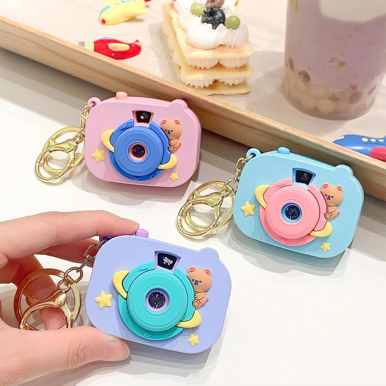 Wholesale Surprise space bear camera buckle projector button switch keyring cute small pendant kaleidoscope projector keychain