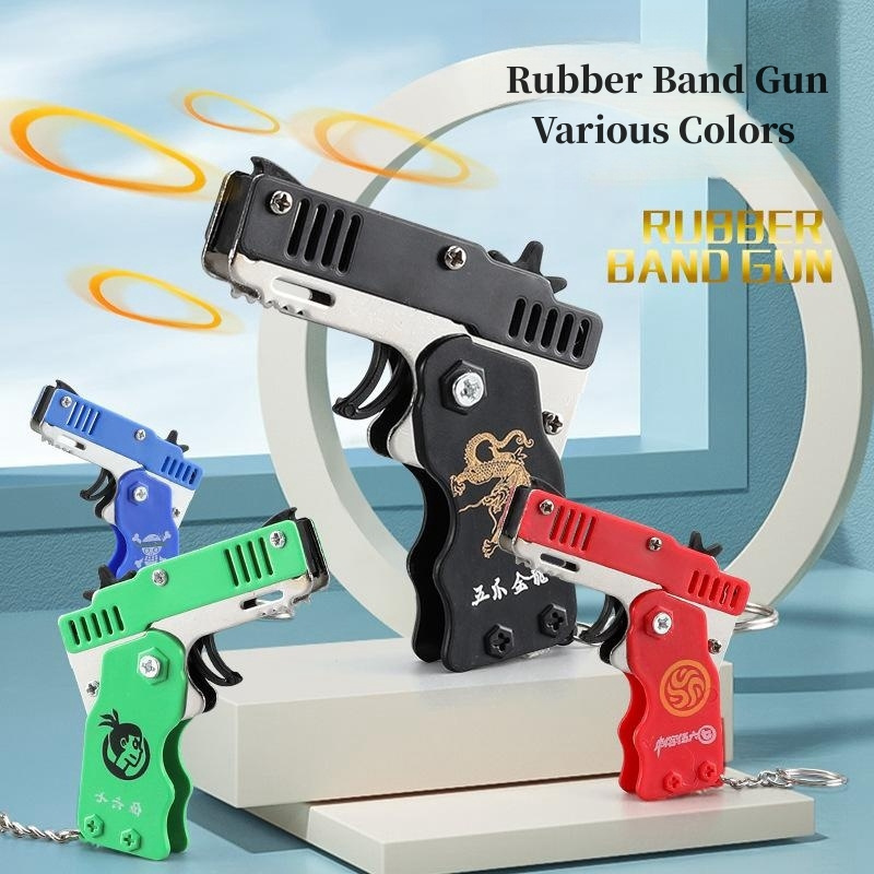 Mini rubber band metal toy gun key chain can be folded bursts for gift competition interaction