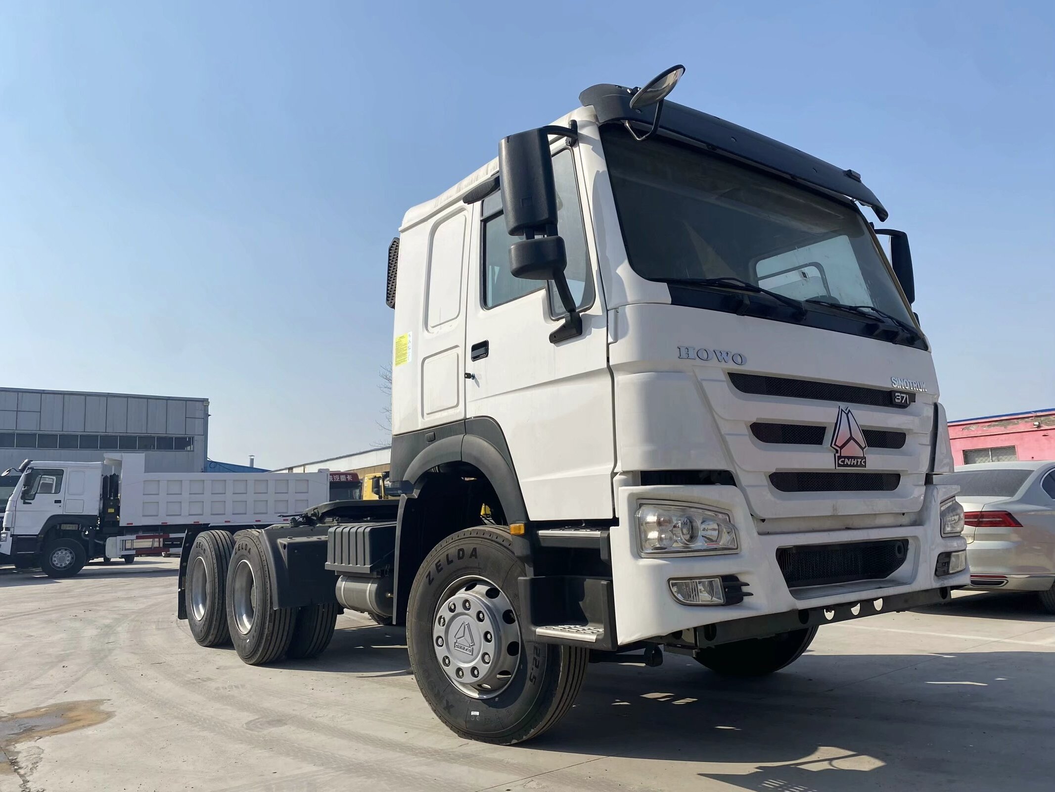 Brand new RHD double sleeper 6X4 HOWO tractor truck 371HP with 1600L extra fuel tank for sale