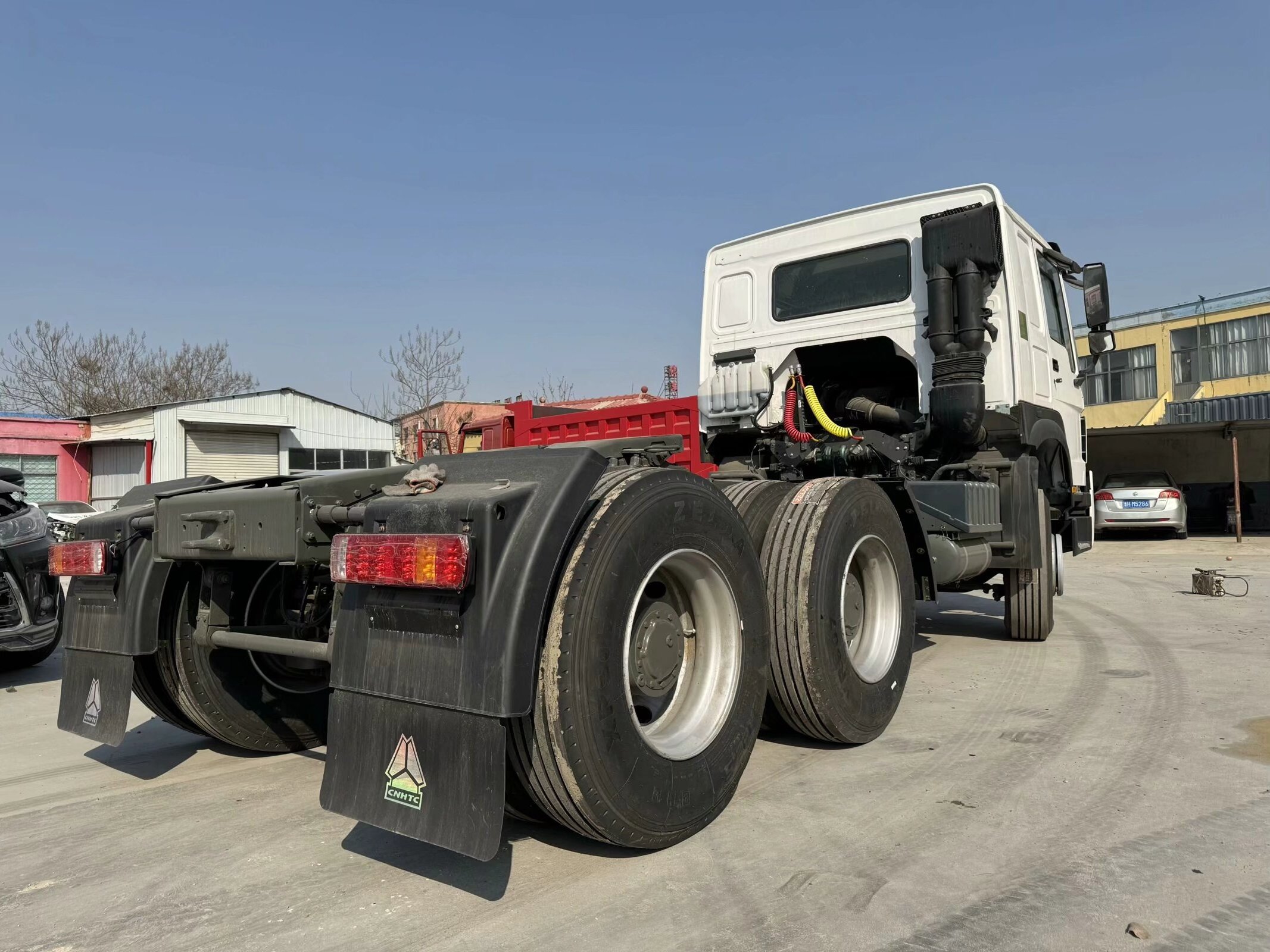 Brand new RHD double sleeper 6X4 HOWO tractor truck 371HP with 1600L extra fuel tank for sale