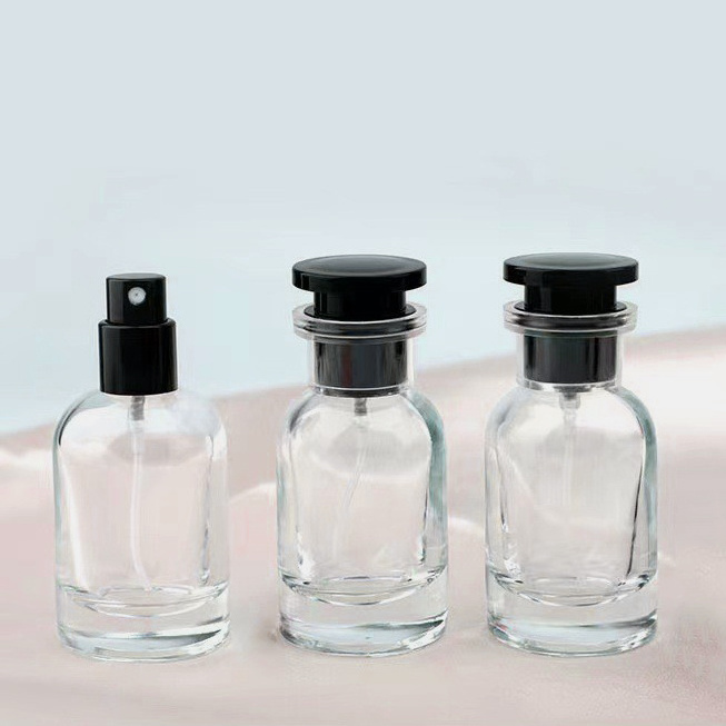 Luxury 50ml round shoulder perfume bottle cap transparent spray refillable glass bottle portable perfume bottle