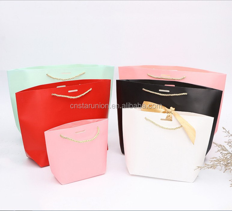 Wholesale cheap price custom logo pink mini small luxury paperbag fancy favor wedding door paper gift bag with ribbon handles