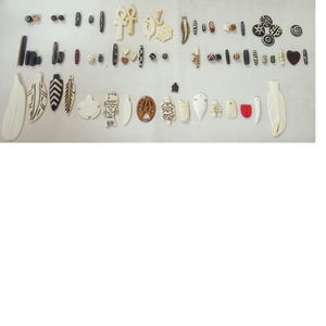 custom made bone beads in assorted sizes with carving and in assorted colors suitable for jewelry designers and bead stores