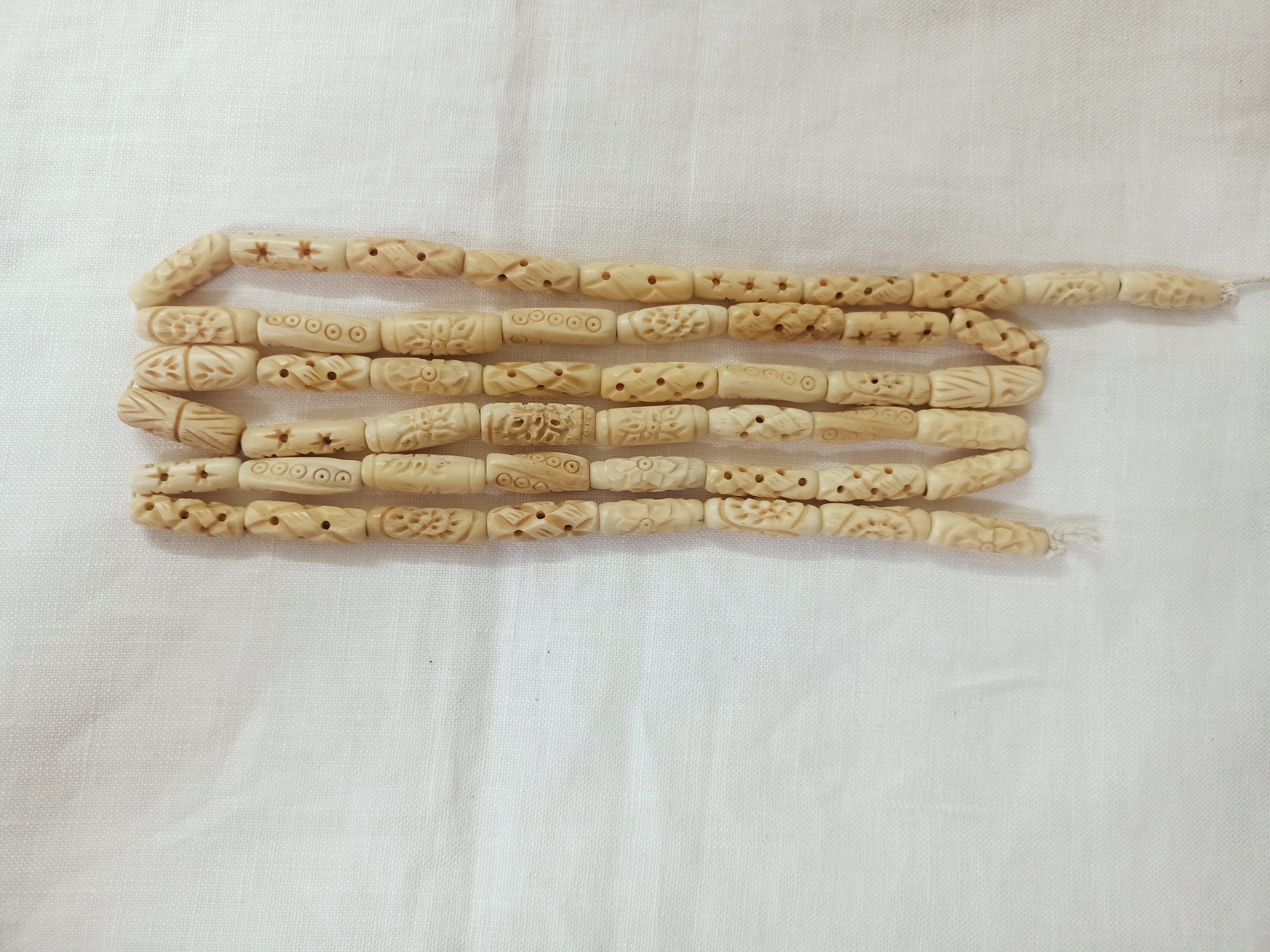 custom made hand carved bone beads in bone hair pipe beads ideal for bone jewelry designers and bead stores