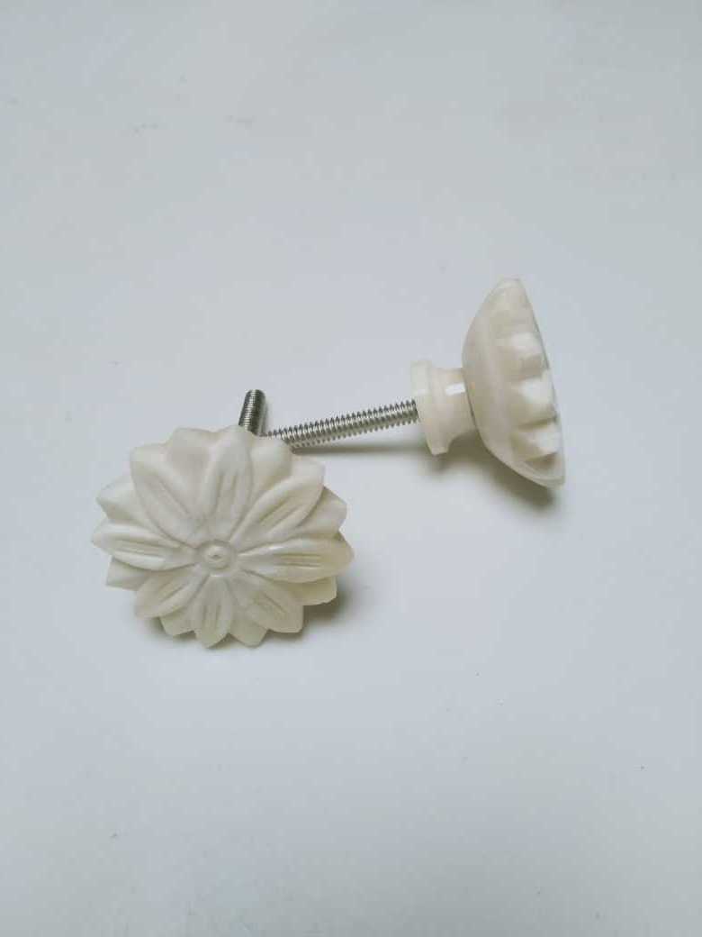 custom made hand carved bone door knobs with floral patterns ideal for interior designers and home furnishing stores