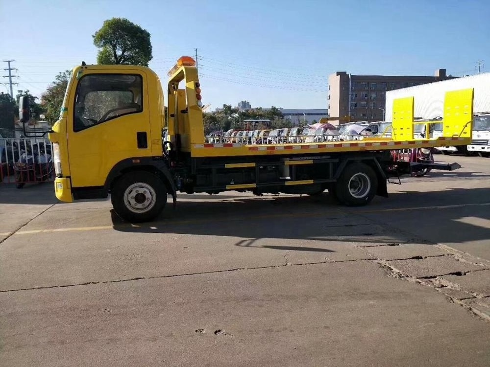 Sinotruk HOWO 4X2 Flatbed tilt tray wrecker truck 3 ton 5 tons tow truck for sale