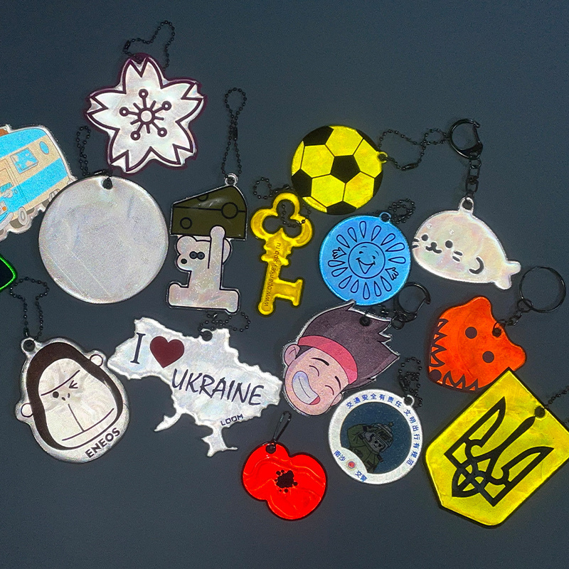 Custom  EN17353 glow in the dark safe reflective keychain for bag backpack pendant