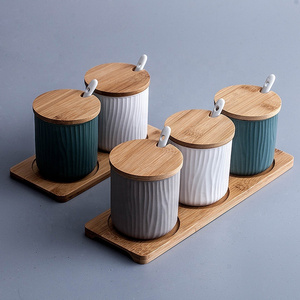 Wholesale colorful kitchen ware seasoning set wooden lid ceramic spice jars with bamboo tray