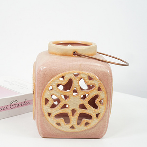 Wholesale unique fancy hollow color glazed cute home decoration hanging ceramic tea light candle holder candle lantern