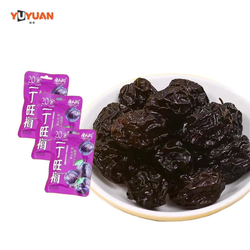 Sour-sweet and tasty preserved prune dried plum for appetizing snacks