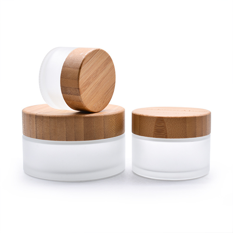 Wholesale price cream cosmetic glass jars with bamboo cap for lady face cream