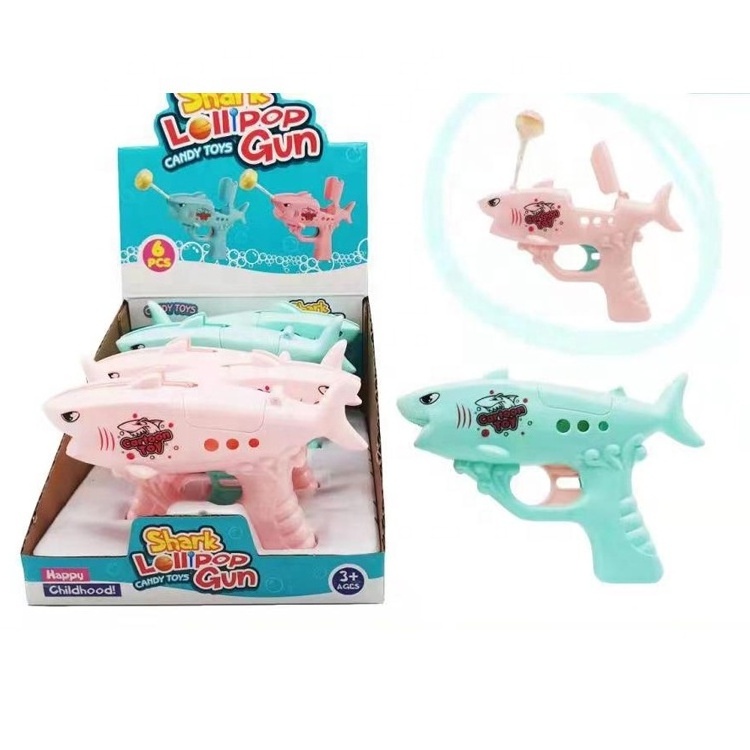 Factory sale lollypop toy wholesale juguetes de caramelos shark lollipop candy toys kids classic toys gun