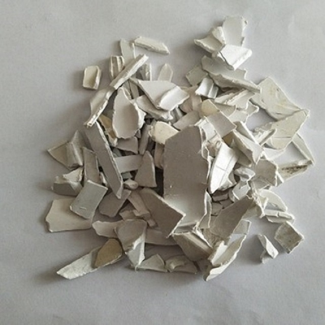 washed rigid PVC regrind scraps from recycled white PVC pipes and fittings