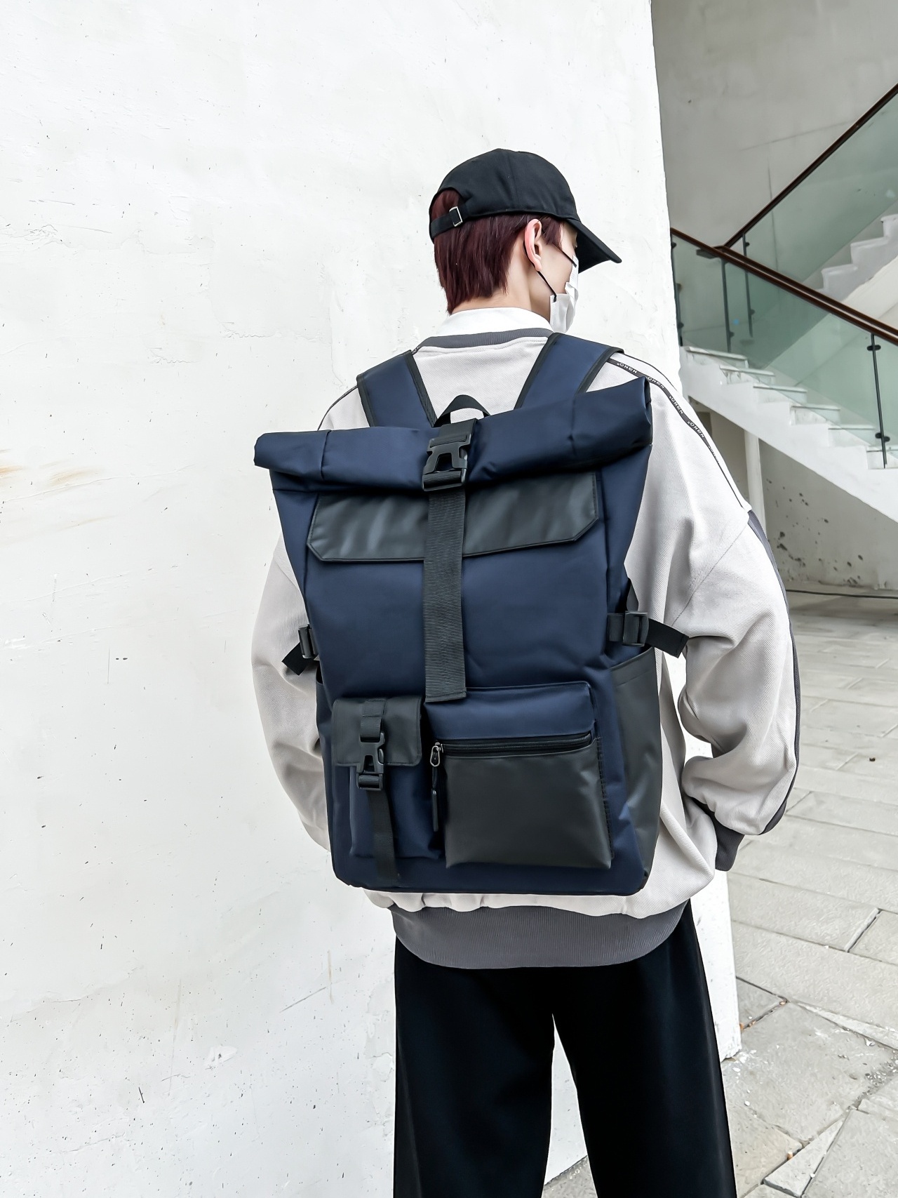 Korean version of the new street fashion trend personality roll-mouth backpack male leisure sports travel backpack