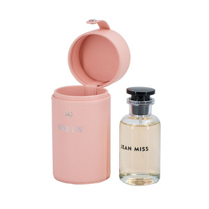 Luxury pu leather round 100ml pink perfume bottle gift packaging box with custom logo empty portable perfume storage box