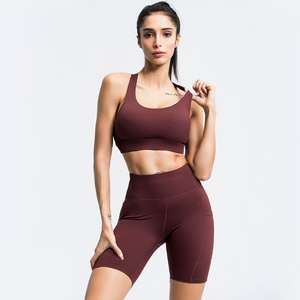 Hot sales active wear gym seamless  halter backless bra shorts with pocket can be printed logo women fitness yoga set for women