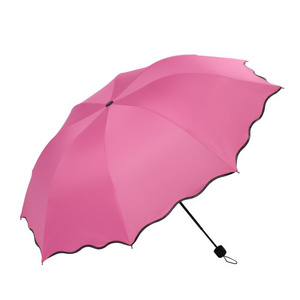 flowering manual rain and rain umbrella oversized folding umbrella Yiwu spot three fold umbrellas hat for the rain