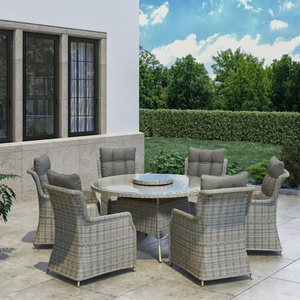 Outdoor furniture with wicker rattan dinning set mix 6 chairs and round table in the garden