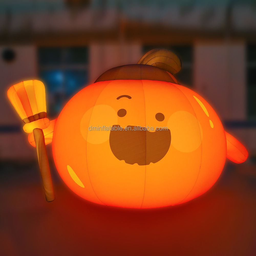 Giant inflatable pumpkin held a broom for advertising promotional event halloween decoration